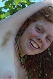 All natural redhead shows off her bush